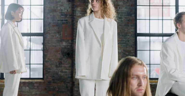 Platforms - Performers Wearing White Coats Standing on Wooden Platforms