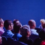 Audience - People Sitting on Gang Chairs