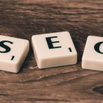 SEO - Three White-and-black Scrabble Tiles on Brown Wooden Surface