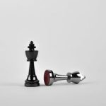 Strategy - Two Silver Chess Pieces on White Surface