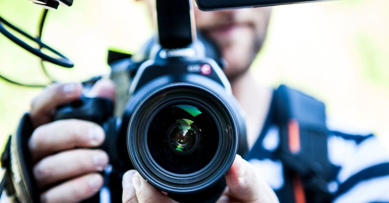 Video - Person Holding Canon Dslr Camera Close-up Photo