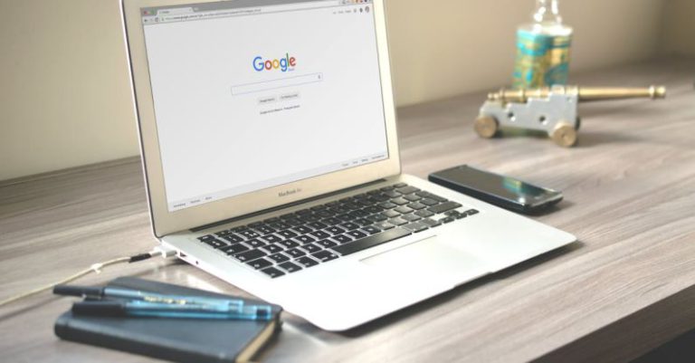 Mobile SEO - Macbook Air on Grey Wooden Table