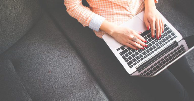 Blog - Person Sitting on Gray Sofa While Using Macbook