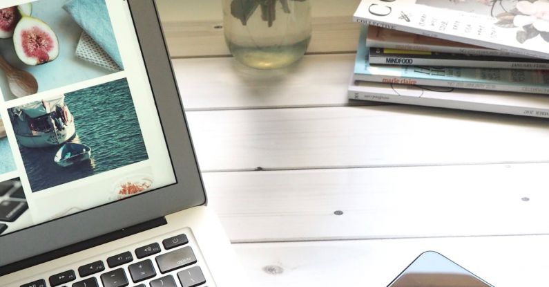 Blog - Macbook Air, Flower Bouquet and Magazines on White Table