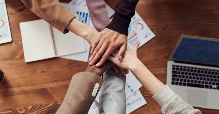 Partnerships - Photo Of People Near Wooden Table